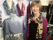 Joanne in her studio wearing the Whitworth Scarf in the summer colours!